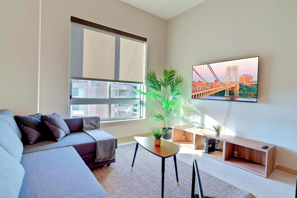 Comfort Apartment, 2 Bedrooms | Living area | 50-inch Smart TV with cable channels