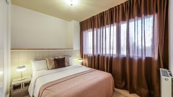 2 dormitorios, tabla de planchar con plancha, wifi gratis y ropa de cama