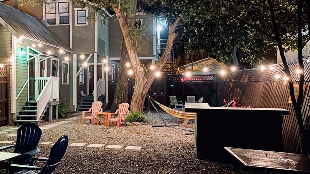 A backyard with a hammock, outdoor seating, and a hot tub. - The Contemporary (Sanford)