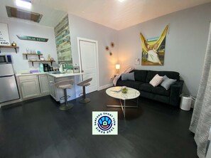 Standard Apartment | Living area | 50-inch LCD TV with digital channels, Netflix, streaming services