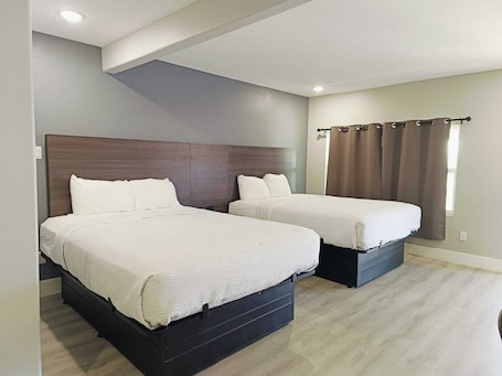 Deluxe Suite, Multiple Beds, Non Smoking | Iron/ironing board, free WiFi, bed sheets