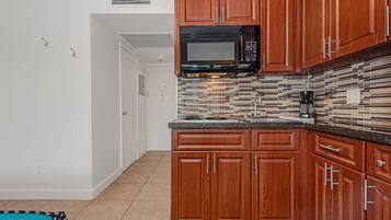 Fridge, microwave, cookware/dishes/utensils