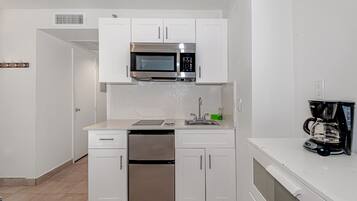 Fridge, microwave, cookware/dishes/utensils