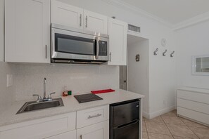 Fridge, microwave, cookware/dishes/utensils