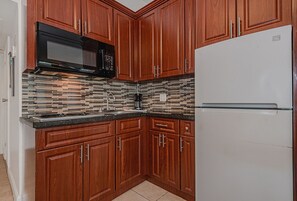 Fridge, microwave, stovetop, cookware/dishes/utensils