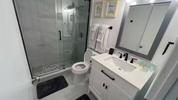 Hair dryer, towels, soap, toilet paper