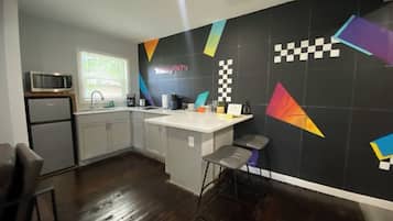 Mini-fridge, microwave, stovetop, coffee/tea maker