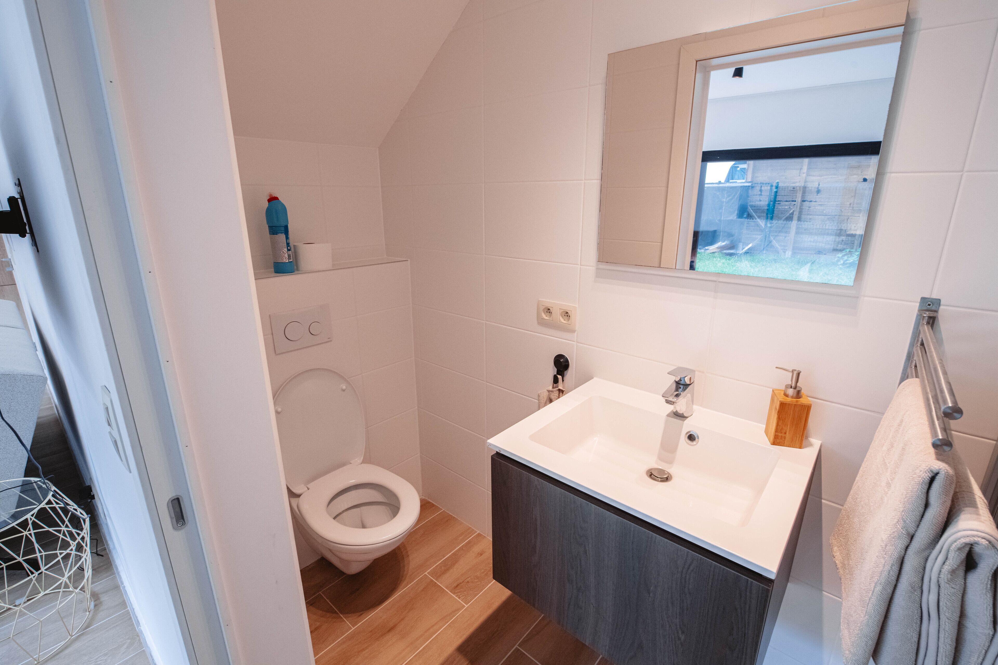 deluxe studio | bathroom | hair dryer, heated floors, towels, soap