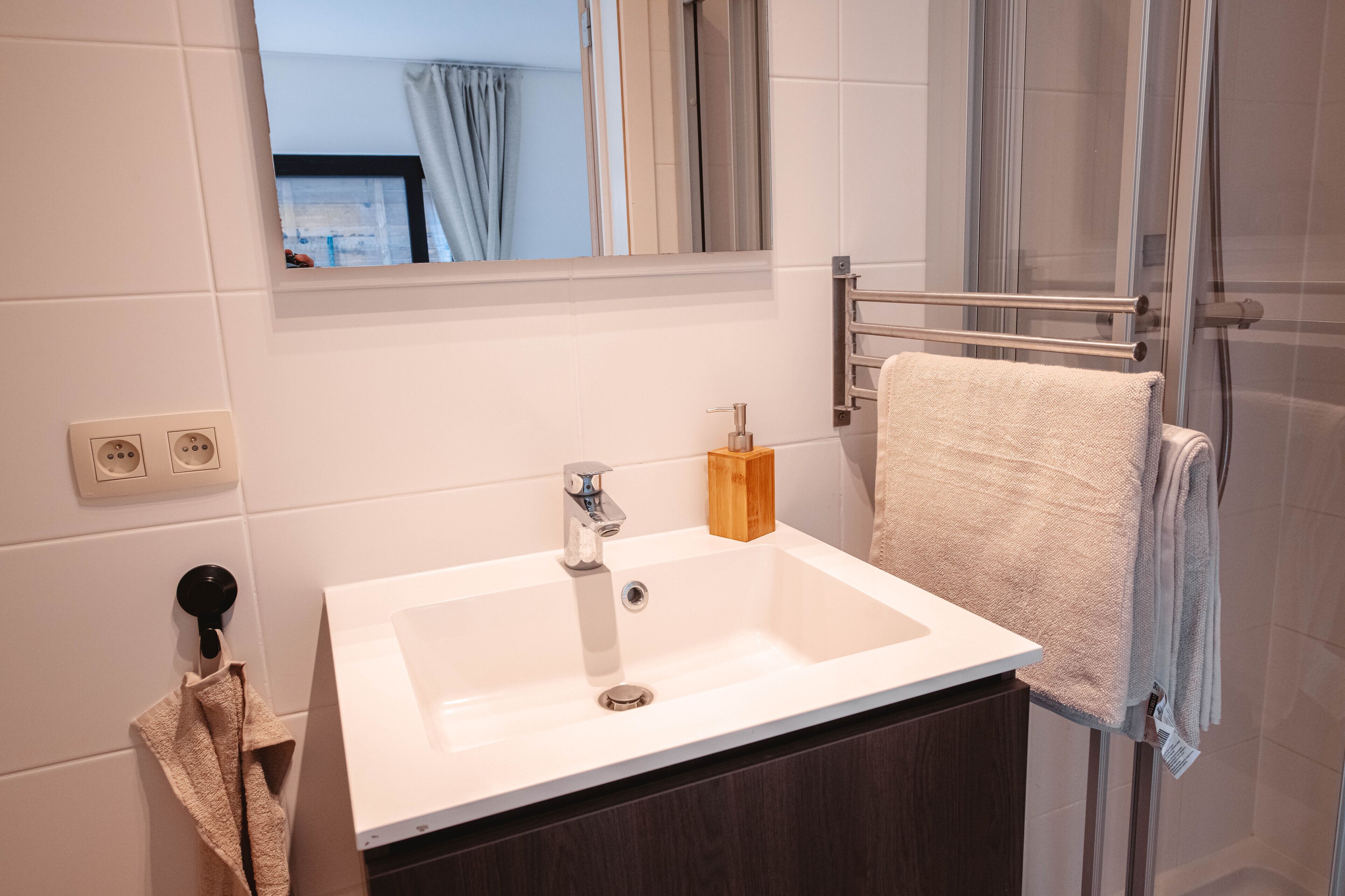 deluxe studio | bathroom | hair dryer, heated floors, towels, soap
