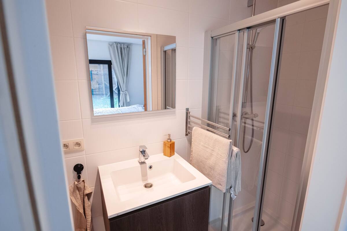 deluxe studio | bathroom | hair dryer, heated floors, towels, soap
