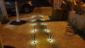 A pathway with evenly spaced lights along its length. - Juana Diaz Spacious Cozy Home Mango trees and avocado. (San Juan)