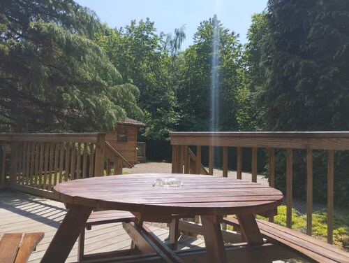 A charming & traditional Scandinavian log cabin within a tranquil setting.