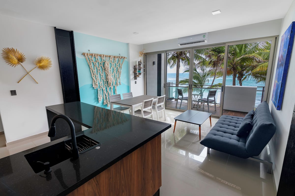 Luxury Apartment, 1 Bedroom, Sea View | Living area | 50-inch Smart TV with cable channels