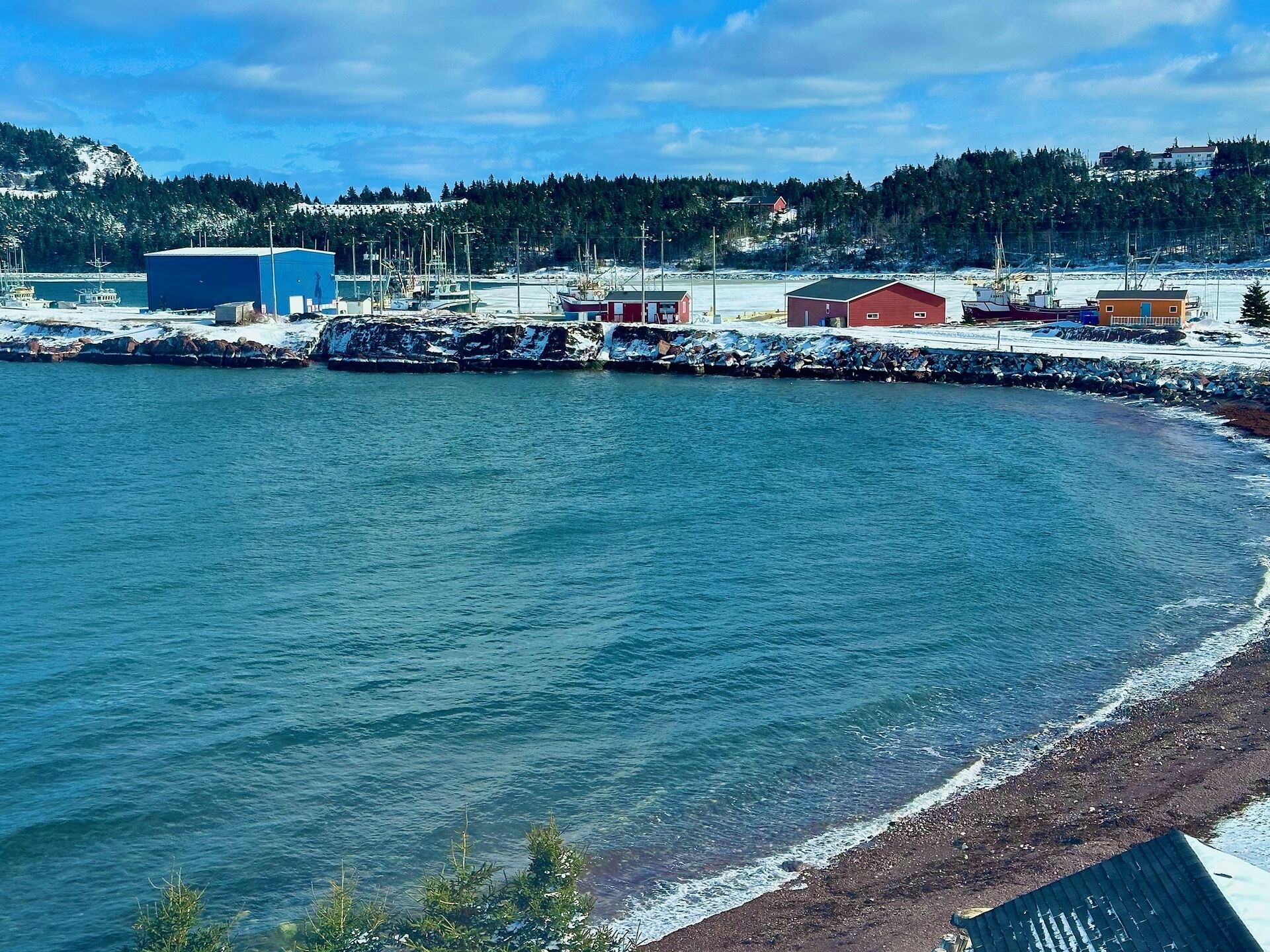 Winter in The Homestead's backyard. The blue building is where fishing boats bring their catch.