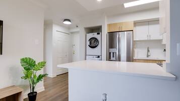 Deluxe Apartment | Living area | 50-inch Smart TV with cable channels