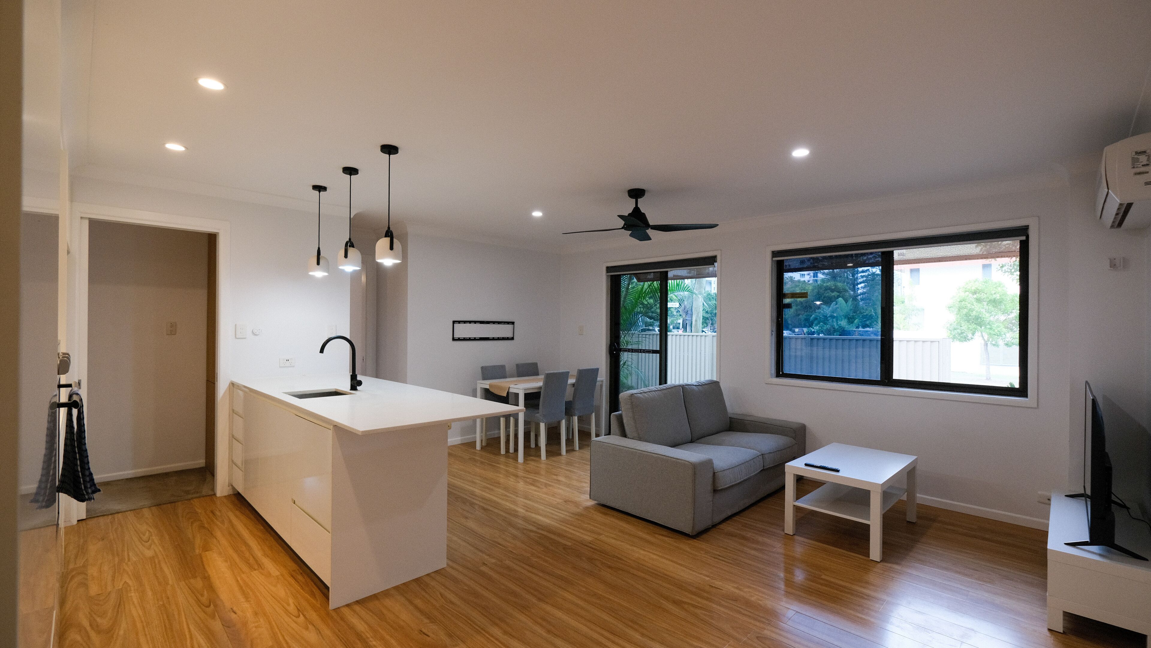 Two-Bedroom Apartment with Private Courtyard | Living area | 50-inch Smart TV with digital channels