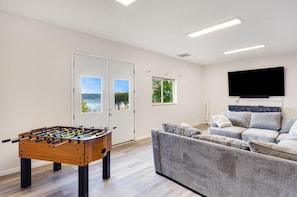 Smart TV, fireplace, table football, books