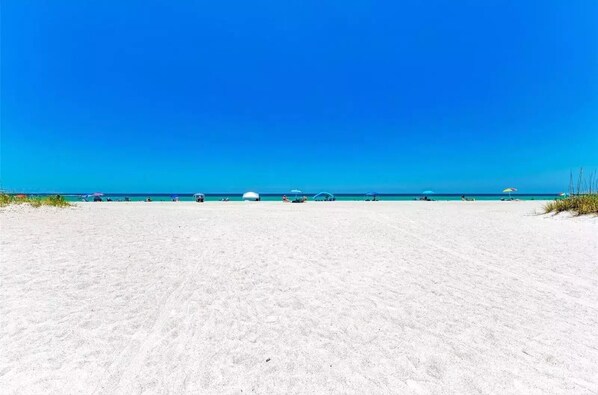 On the beach, sun-loungers, beach towels