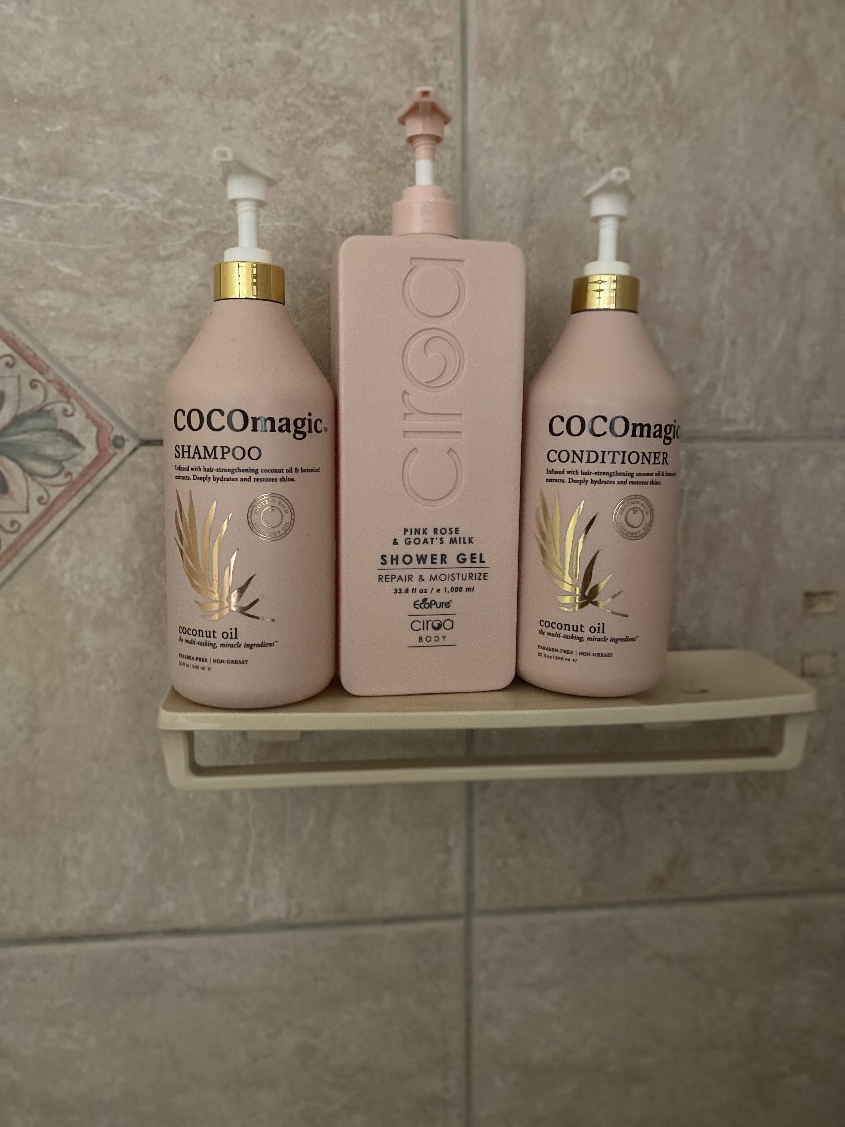 Three bottles of COCOmagic products on a shelf.