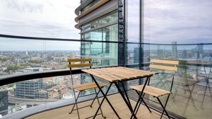 A high-rise building with a panoramic city view.