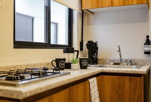 Fridge, microwave, stovetop, coffee/tea maker