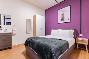 1 bedroom, desk, iron/ironing board, bed sheets