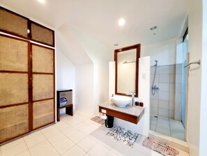 Shower, eco-friendly toiletries, hair dryer, slippers