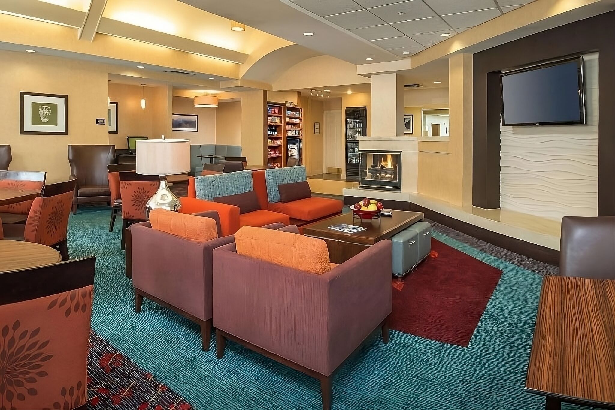 Settle into the stylish lobby lounge with warm, inviting seating
