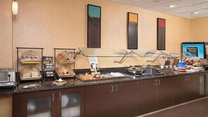 A buffet setup with various food items and a 'Minute Maid' sign. - Spacious Accommodation in Charleston! W/ Private Kitchenette! Pets are Welcome! (Charleston)