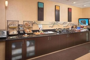 A buffet setup with various food items and a 'Minute Maid' sign. - Spacious Accommodation in Charleston! W/ Private Kitchenette! Pets are Welcome! (Charleston)