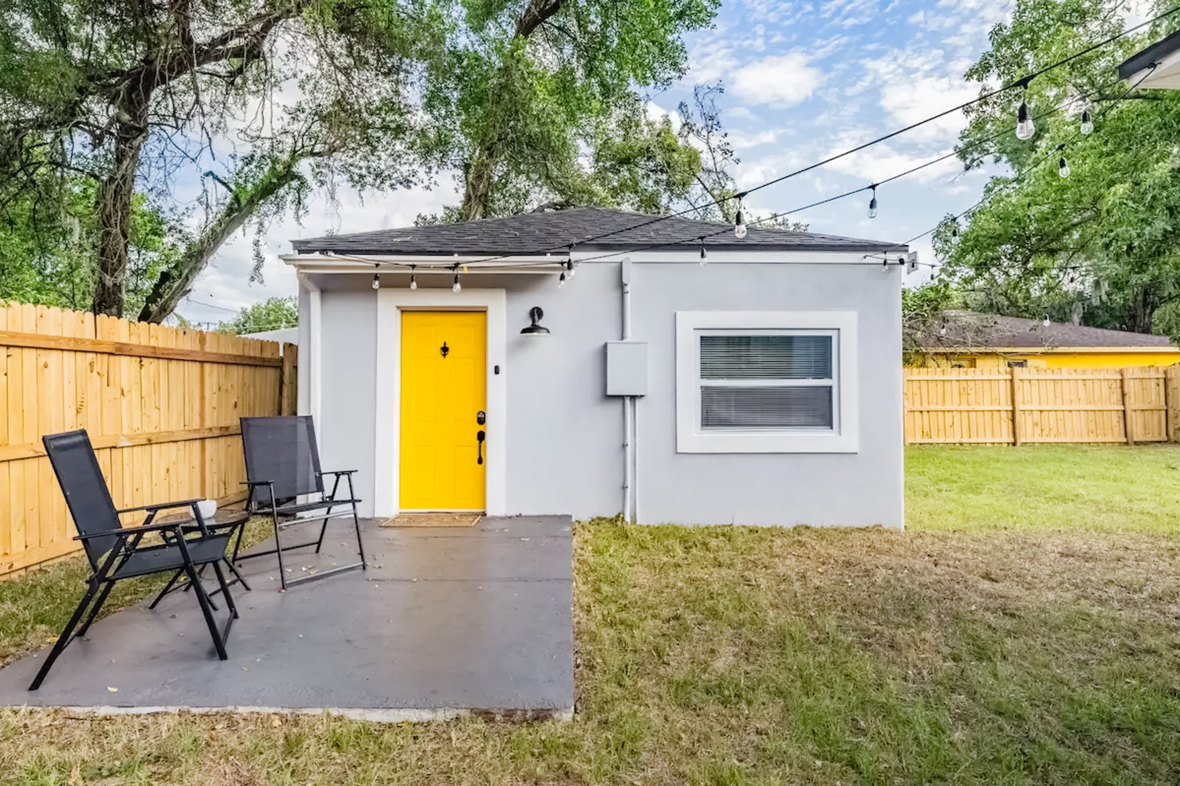 Private in-law suite with fenced yard, updated interior, & great location