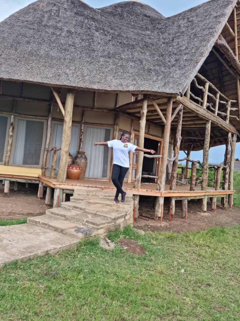 A rustic building with a thatched roof and wooden structure.
