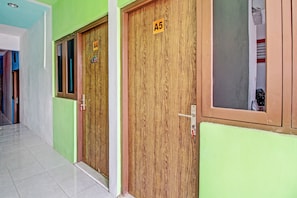 A hallway with wooden doors labeled A4 and A5, leading to rooms.