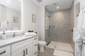 Shower, hair dryer, towels, soap