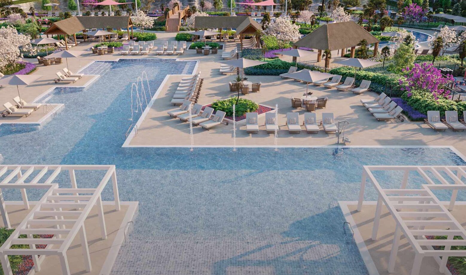 A resort pool area with multiple sun loungers, a central water feature, and surrounding greenery.
