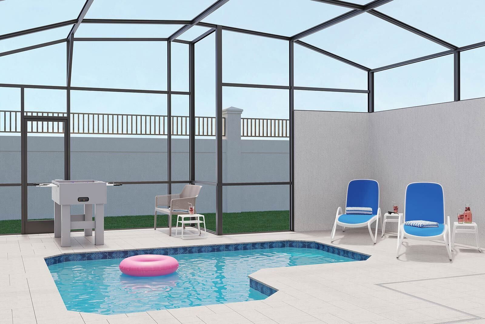 An indoor swimming pool with a glass enclosure, two blue lounge chairs, a white table, and a pink inflatable ring.