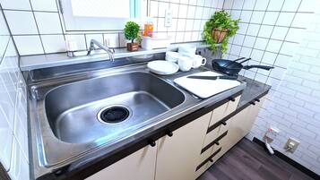 Fridge, microwave, stovetop, cookware/dishes/utensils