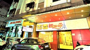 A building with multiple signs, including "Jaybajrang Enterprise" and "Europa-Inn". - Hotel Europa Inn (Rajkot)