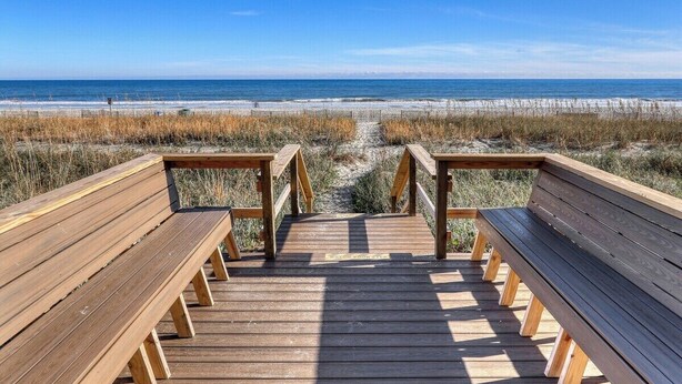 A wooden boardwalk leading to a beach with a clear view of the ocean. - RT-0703 Oceanfront 1-Bedroom Condo at Roxanne Towers, Myrtle Beach - Sleeps 6 (Myrtle Beach)