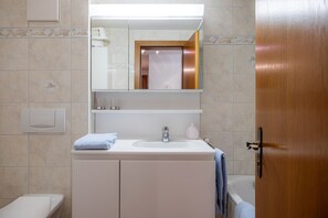 Panoramic apartment plus 150 CHF cleaning fee on top of the rate | Bathroom | Hydromassage showerhead, hair dryer, heated floors, towels