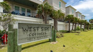 A sign for West Side Cottages at 1592 W. Beach Blvd. - West Side Cottages N - Your Gulf Shores Paradise Awaits (Gulf Shores)