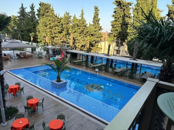 Outdoor pool, open 9:30 AM to 6:00 PM, pool umbrellas, sun loungers