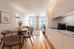 Enjoy a meal at the dining table, relax on the sofa, or brew a fresh cup of coffee in this stylish apartment.