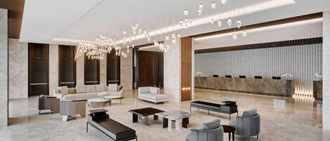 Un vestíbulo moderno con suelo de mármol, muebles contemporáneos y una lámpara decorativa.