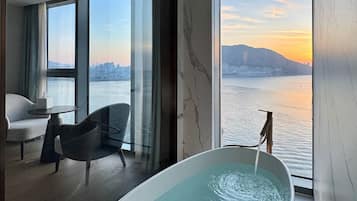 Designer toiletries, hair dryer, bathrobes, slippers