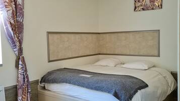 1 bedroom, desk, iron/ironing board, travel crib