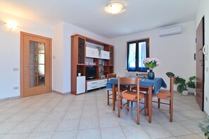 Basic Apartment | Living area | 49-inch Smart TV with cable channels - IzzHome Lemon Tree (Pula)