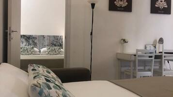 1 bedroom, desk, iron/ironing board, travel crib