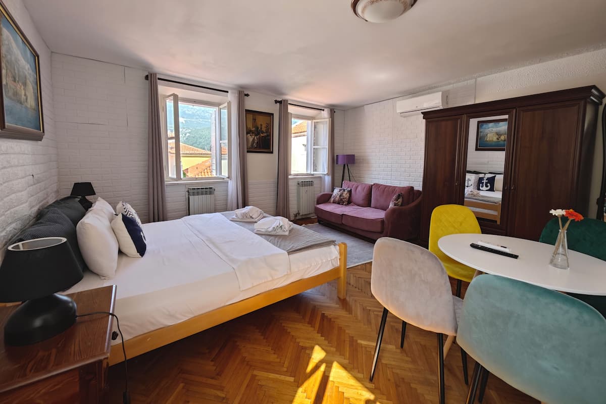 Family Studio, City View | In-room safe, soundproofing, iron/ironing board, free WiFi