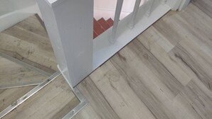 A white staircase with a wooden floor. - Niles Spacious 2-Story Family & Work Haven (Niles)